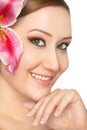 Smiling woman lily in hair Royalty Free Stock Photo