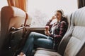 Smiling Woman Listening Music in Tourist Bus Royalty Free Stock Photo