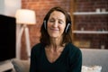 Smiling Woman Listening Music Using Headphones Royalty Free Stock Photo