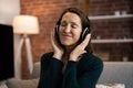 Smiling Woman Listening Music Using Headphones Royalty Free Stock Photo