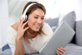 Smiling woman listening to music with headphones Royalty Free Stock Photo