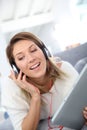 Smiling woman listening to music with headphones Royalty Free Stock Photo