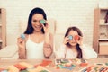 Smiling Woman and Little Girl Close Eyes of Cubes.