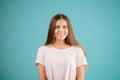 Smiling woman with long streight brown hair in white T-shit Royalty Free Stock Photo