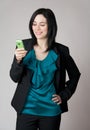 Smiling woman looking at her cell phone Royalty Free Stock Photo