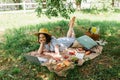 Smiling woman looking at laptop near