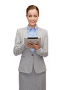 Smiling woman looking at tablet pc computer Royalty Free Stock Photo