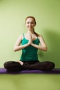 Smiling woman in lotus pose Royalty Free Stock Photo