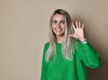 Smiling woman making high five with her hand Royalty Free Stock Photo