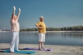 Smiling woman and a man exercising together