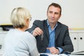 Smiling woman meeting with realtor Royalty Free Stock Photo