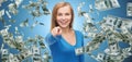 Smiling woman with money pointing finger on you Royalty Free Stock Photo