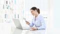 Smiling woman in office search on computer with magnifying glass Royalty Free Stock Photo