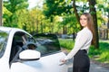 Smiling woman opening door of car Royalty Free Stock Photo