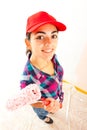 Smiling woman with paint roller Royalty Free Stock Photo