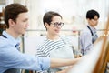 Smiling Woman Painting in Class Royalty Free Stock Photo