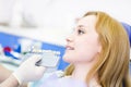 Smiling woman with palette for tooth color