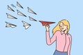 Smiling businesswoman with paper plane in hands