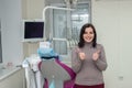 Smiling woman patient in dentistry after stomatological procedures Royalty Free Stock Photo