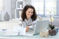 Smiling woman paying online