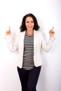 Smiling woman pointing fingers in air Royalty Free Stock Photo