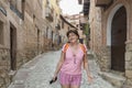 Smiling woman for a portrait on her vacation in AlbarracÃÂ­n, Teruel, Spain