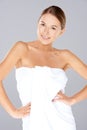 Smiling woman posing in a white towel Royalty Free Stock Photo