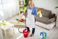 Smiling woman prepared for cleaning house