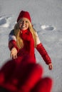 Smiling woman reaching out hand, winter Royalty Free Stock Photo