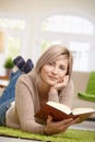 Smiling woman reading book Royalty Free Stock Photo