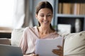 Smiling woman reading good news in paper letter or documents Royalty Free Stock Photo