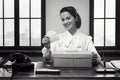 Smiling woman receiving a gift box by mail