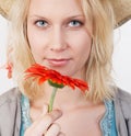 Smiling woman with red flower