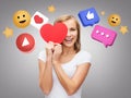 smiling woman with red heart and internet icons Royalty Free Stock Photo