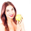 Smiling woman with red lips holding a green apple.