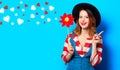 Smiling woman with red pinwheel with hearts Royalty Free Stock Photo