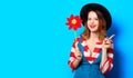 Smiling woman with red pinwheel Royalty Free Stock Photo