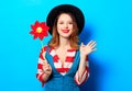 Smiling woman with red pinwheel Royalty Free Stock Photo