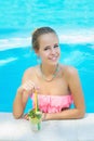 Smiling woman relaxing the pool with lemonade Royalty Free Stock Photo