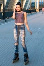 Smiling woman on rollerblades.