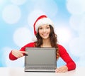 Smiling woman in santa helper hat with laptop Royalty Free Stock Photo