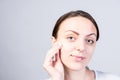 Smiling Woman Scrubbing Face Using Facial Cleanser Royalty Free Stock Photo