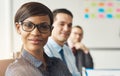 Smiling woman seated with men in meeting Royalty Free Stock Photo