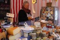 Smiling Woman selling Artisan cheese at city centre market in Dublin