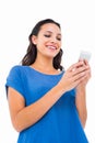 Smiling woman sending a text message Royalty Free Stock Photo