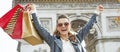 Smiling woman with shopping bags in Paris, France rejoicing Royalty Free Stock Photo