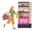 Smiling woman shopping in a cosmetics store. Young fashion girl picks up packages with toiletry