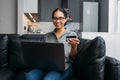 Smiling woman shopping online with credit card Royalty Free Stock Photo