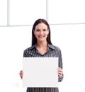 Smiling woman showing a big business card Royalty Free Stock Photo