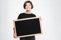 Smiling woman showing blank board Royalty Free Stock Photo